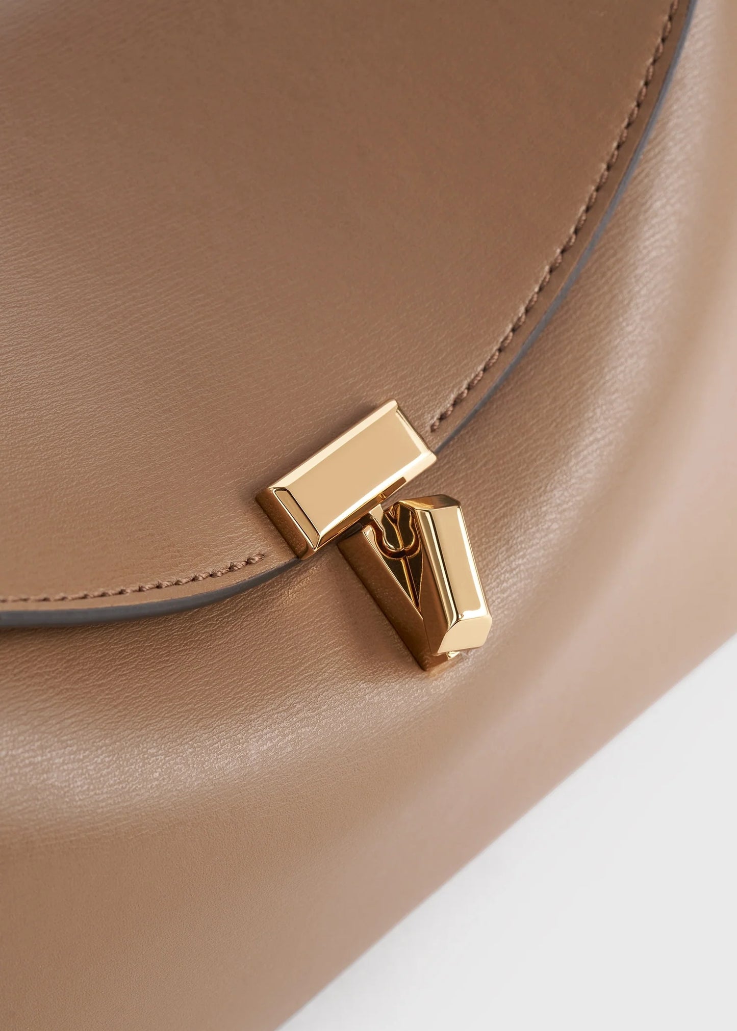 Toteme T-Lock leather clutch camel