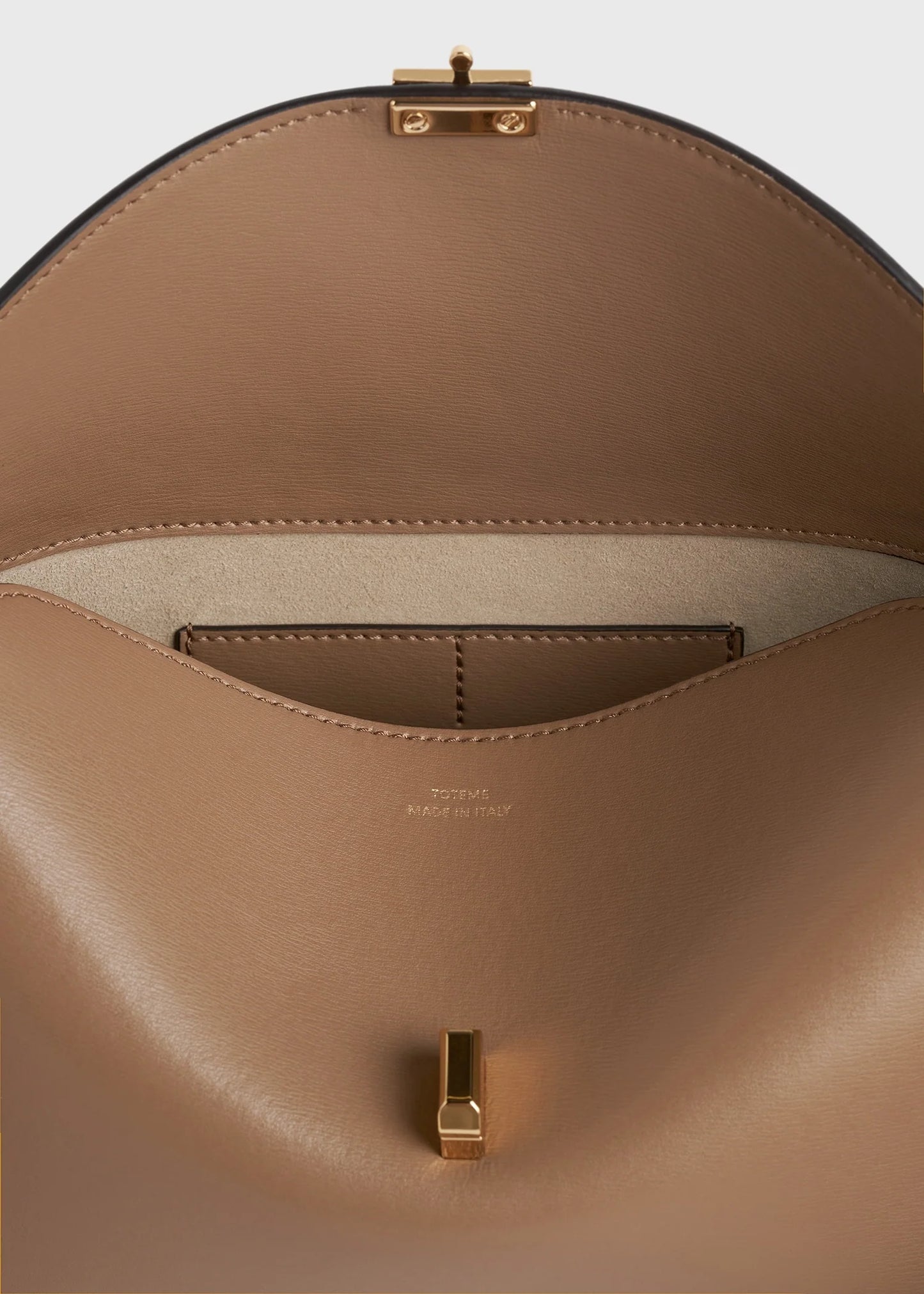 Toteme T-Lock leather clutch camel