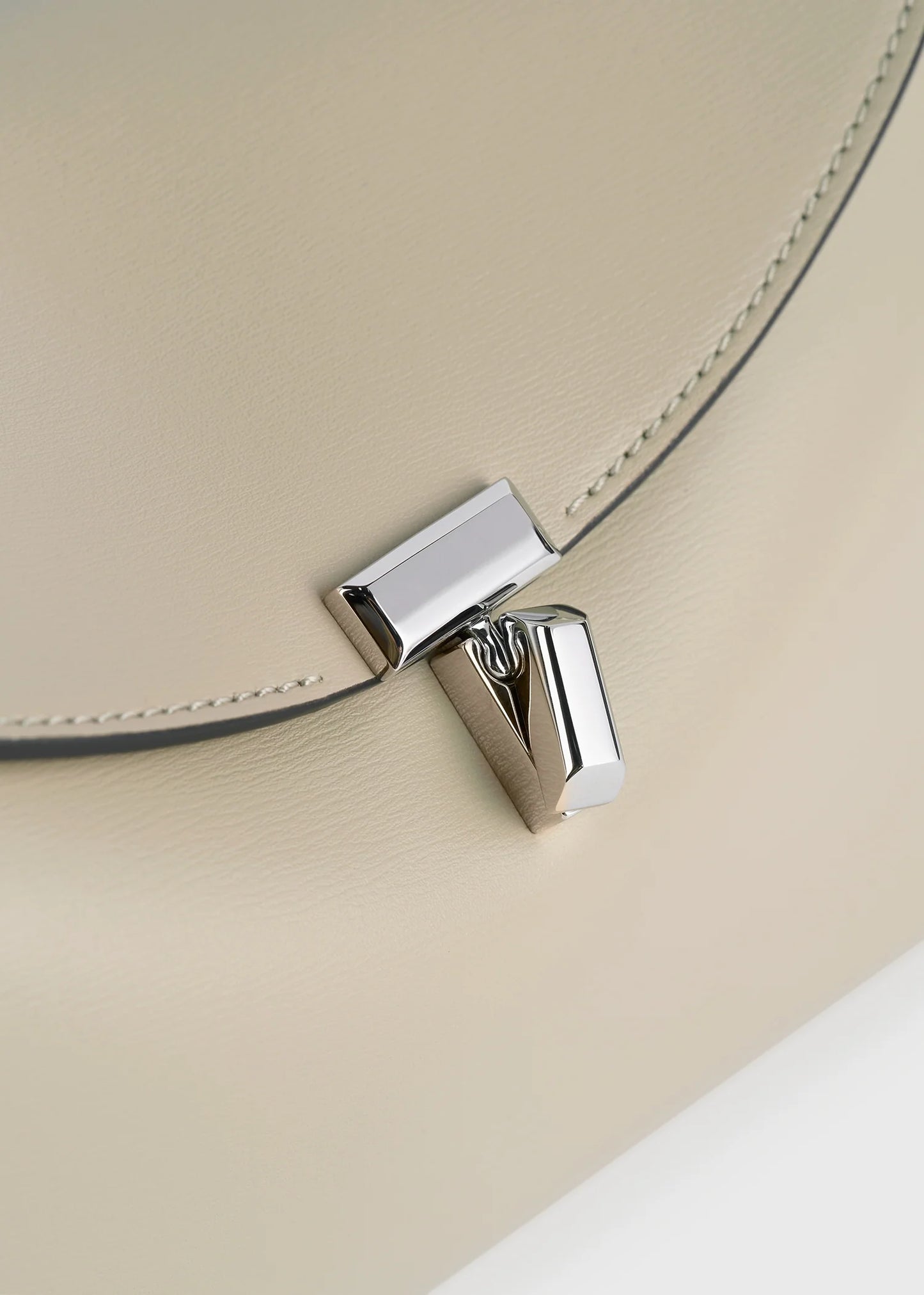 Toteme T-Lock leather clutch fawn